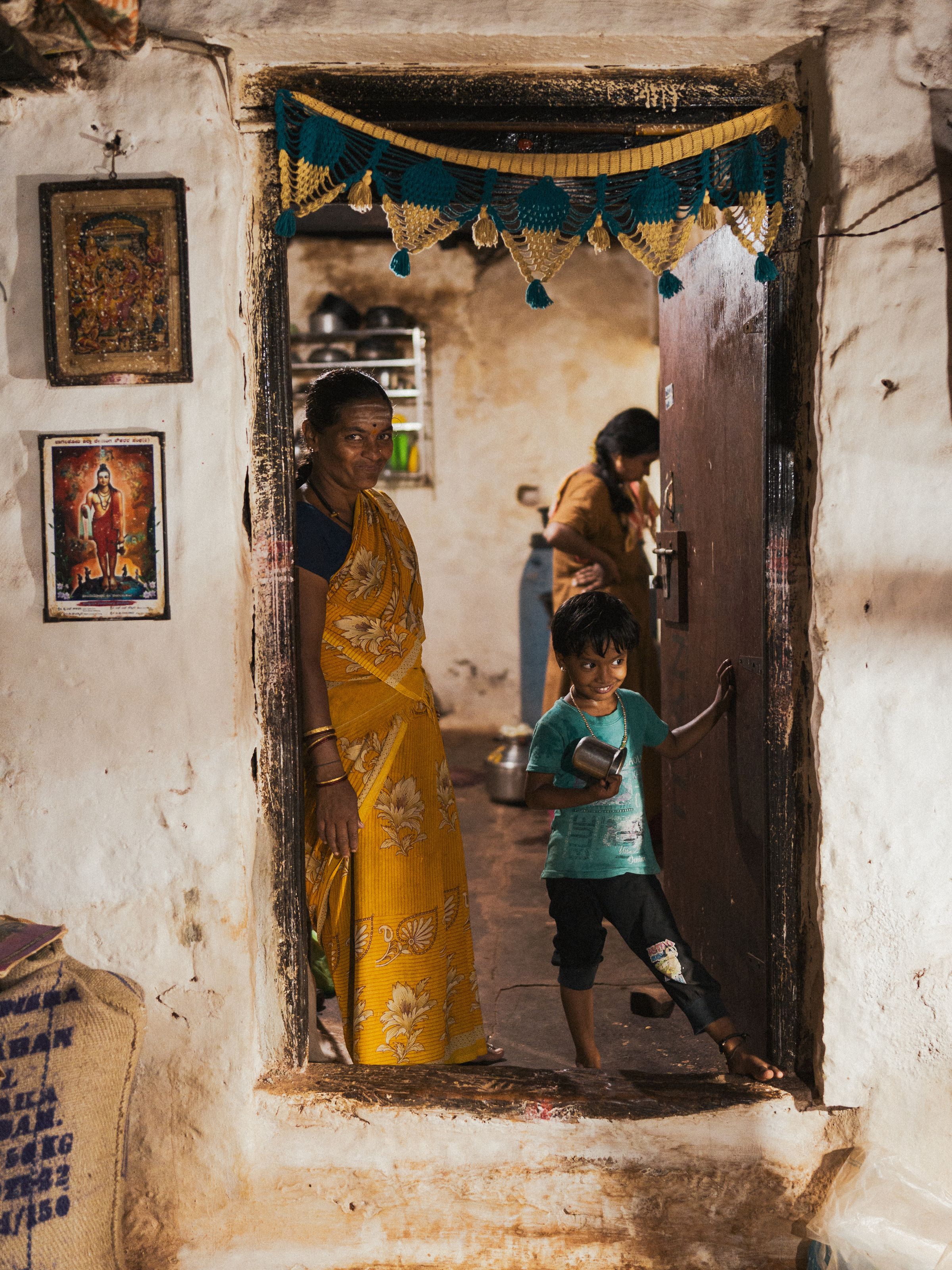 An Indian family at the entrance of their new home