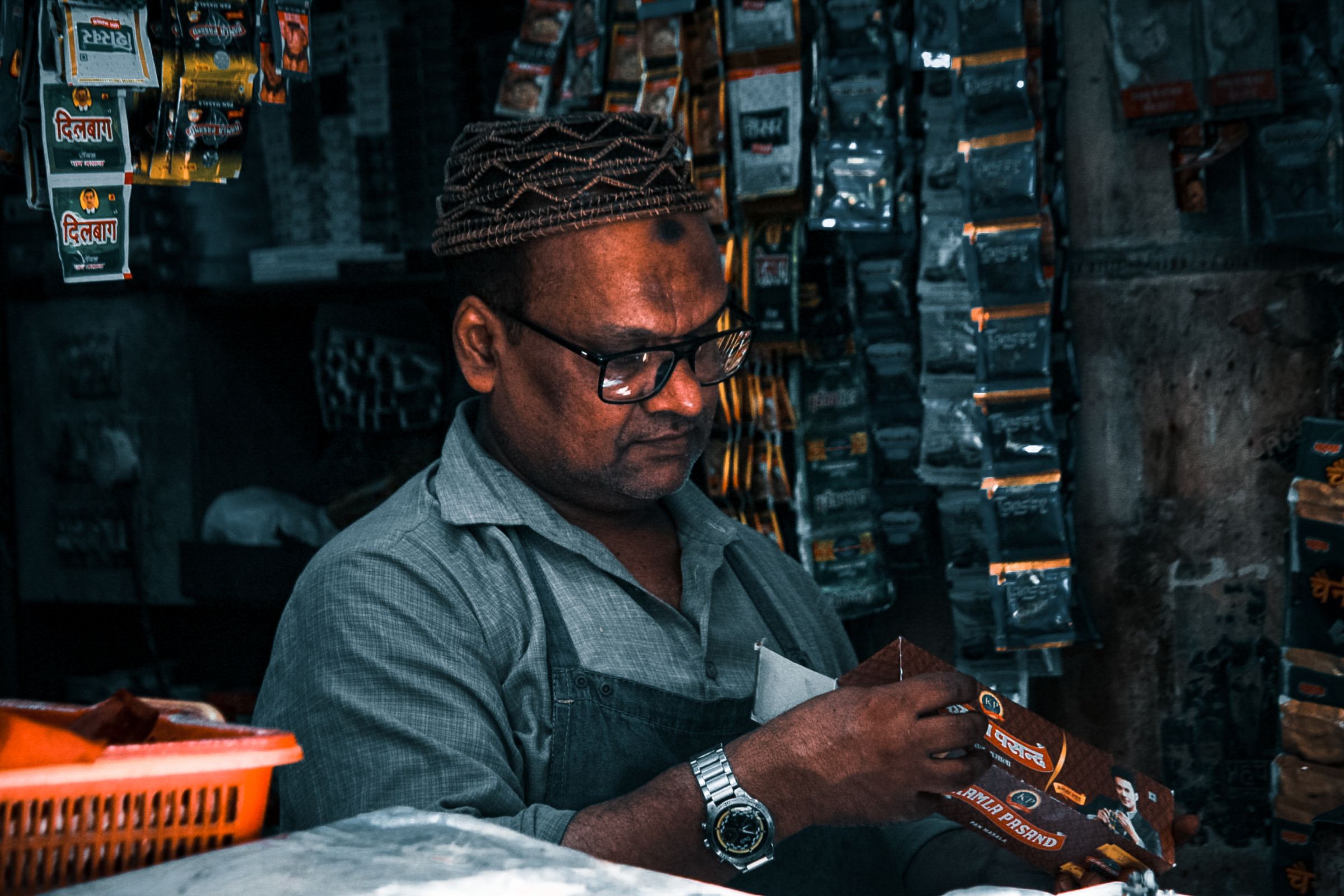 A business owner at his shop counter